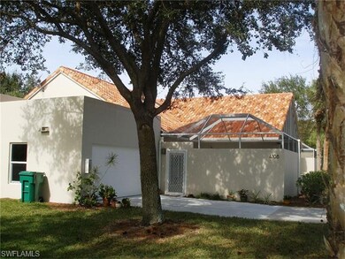 Mature trees and green grass add to the appeal of 
