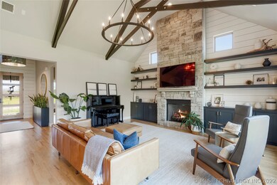 Floor-to-ceiling stone fireplace flanked by built-