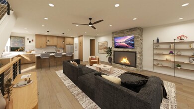Living room featuring recessed lighting, a fireplace, a ceiling fan, and light wood-type flooring
