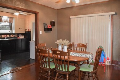 Dining room with wood flooring.