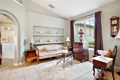 Formal Living Room with Arched Entry and Built In 