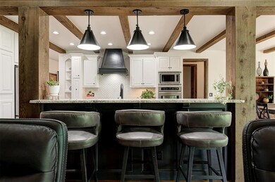 Bar top seating between the living room and kitche