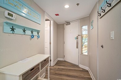 Mudroom with dark wood-type flooring, baseboards, and recessed lighting