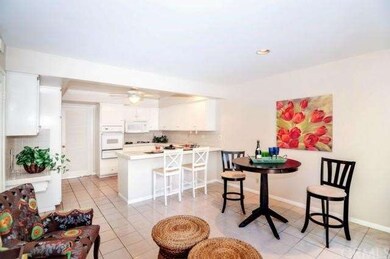 Kitchen area is clean and light and opens to the f