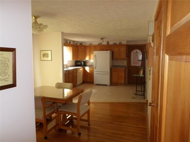 View of dining area and kitchen.