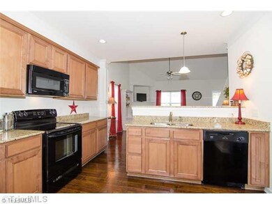 Kitchen. Large Kitchen with Granite Counters, Pantry, and Bar Area