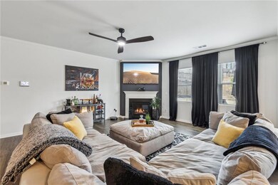 Living room featuring ornamental molding, LVP / wo