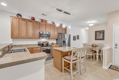 Kitchen featuring sink, appliances with stainless 