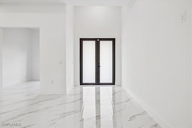 Spare room featuring french doors