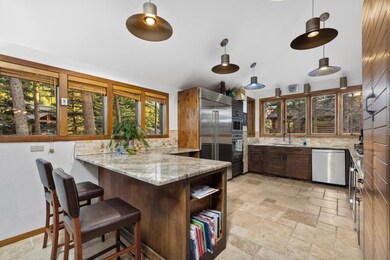 Kitchen with built in appliances, decorative backs