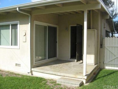 Back yard patio with double pane sliding glass doo