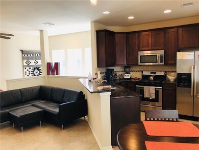 Kitchen featuring visible vents, decorative backs