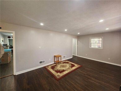 Basement featuring dark hardwood / wood-style floo