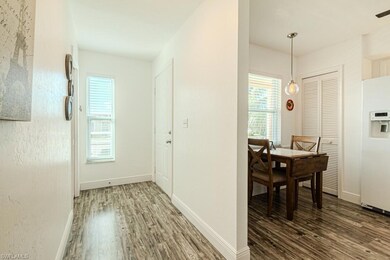 Living room with lofted ceiling, hardwood / wood-s