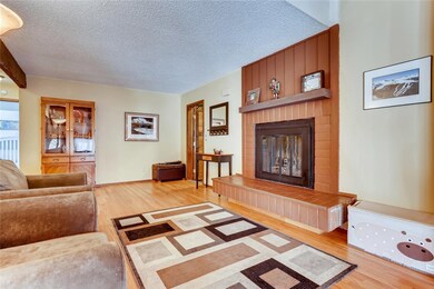 Living room on the front (East) side of house; ent