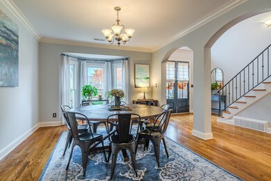Dining Room with hardwood and bay window