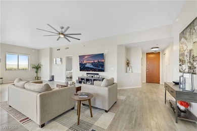 Living area featuring light wood-style flooring, a