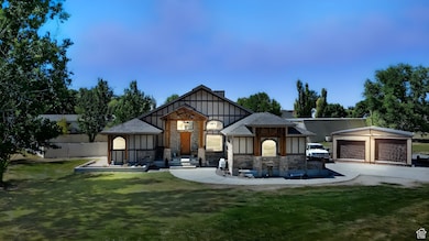 View of front of house with board and batten siding, stone siding, and a front yard