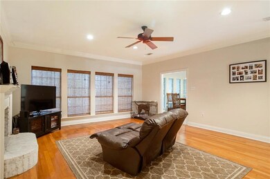 LIVING ROOM, WITH FIREPLACE OVER LOOKING BACKYARD