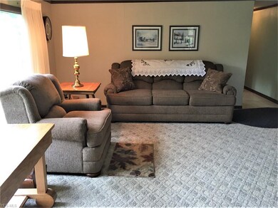 A PICTURE OF THE LIVING ROOM BEFORE THE SELLER REC