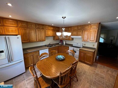 Has oak cabinets and granite countertops.