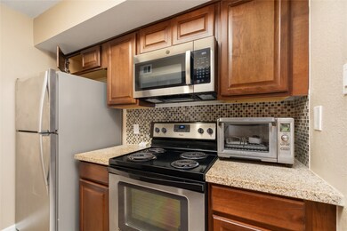 This kitchen features modern stainless steel appli