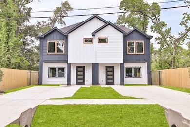 The property is set within a fenced area, offering