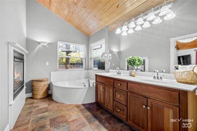 Amazing master bath with fireplace soaking tub, st