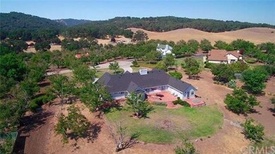 The 2.4 acre lot is studded with producing walnuts