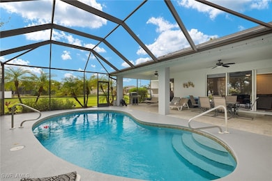 View of pool featuring a lanai, a patio area, ceil