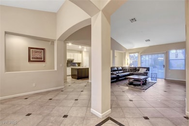 Living room featuring light tile patterned floorin