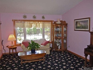 Formal living room overlooks the front garden.
