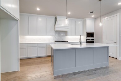 Kitchen with appliances with stainless steel finis