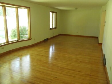 LARGE LIVING ROOM WITH HARDWOOD FLOORS