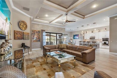 Living room featuring coffered ceiling, visible ve