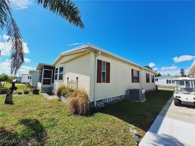 View of property exterior with crawl space, a lawn
