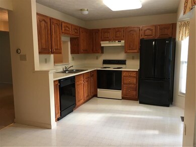 FULLY EQUIPPED KITCHEN WITH OAK CABINETRY, REFRIGE