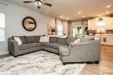 Living room with recessed lighting, visible vents,