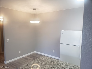 Unfurnished dining area with wood finished floors