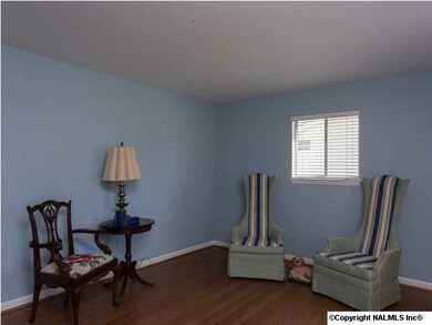 Separate living room with hardwood floors