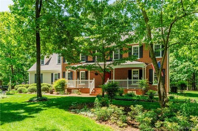 Colonial home with a front lawn