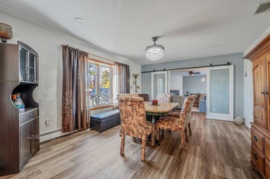 Dining space featuring visible vents, light wood-s