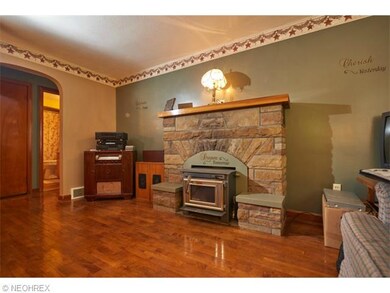 Living room with hardwood floors and fireplace
