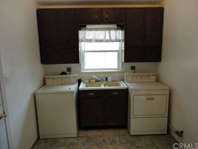 Large laundry room in rear of home 