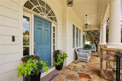 A true Southern welcome—this generous front porch blends charm and comfort!