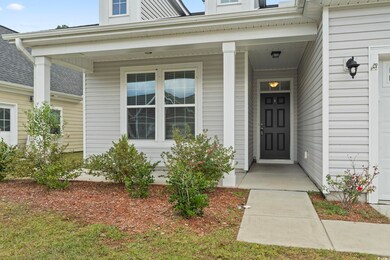Doorway to property with covered porch