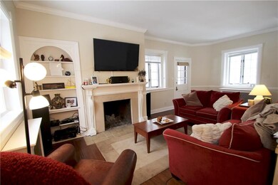 Living room with Hardwood floors and fireplace. Ba