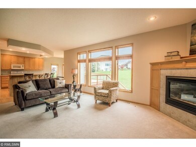 Living room offers grand wall of windows to bring 