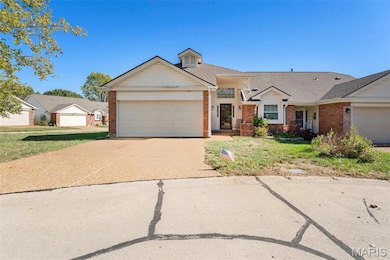 View of front of property with brick siding, driveway, a garage, roof with shingles, and a front lawn