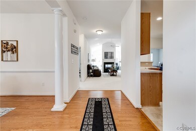 Hallway featuring Vaulted Ceiling, Light Wood-Type